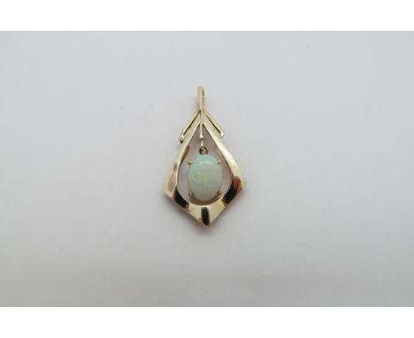 A 14ct (hallmarked) yellow gold and opal pendant - 3cm - weight approx 2.6 grams 