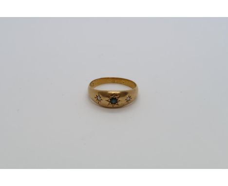 An 18ct yellow gold (hallmarked) gypsy ring with diamonds and sapphires - ring size Q - 4 grams 