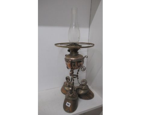 An unusual oil lamp mounted on three hoof feet 