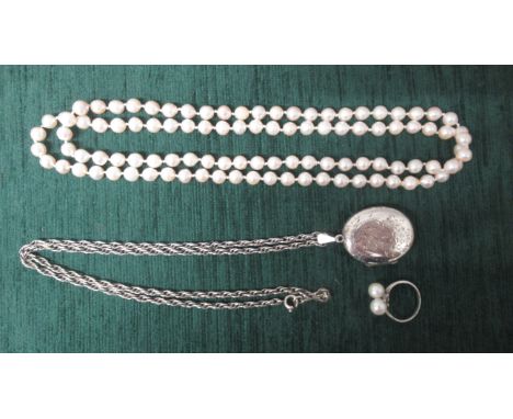 A silver locket on chain together with a silver and pearl ring and a string of pearls