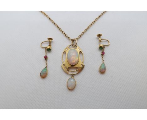 A 15ct yellow gold (hallmarked) Art-Nouveau opal pendant with rose cut diamond accents - central oval shaped opal with opal d