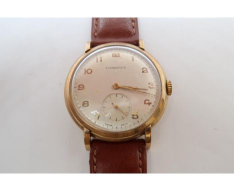 A gents 9ct gold cased Longines manual wind wristwatch - case 34mm - with seconds sub dial - working in the saleroom 