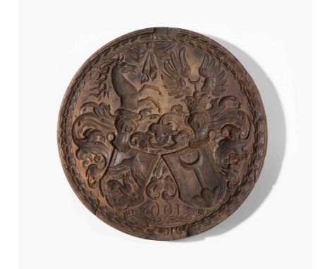   Tirggel-Model  Zürich, datiert 1665. Fruchtholz mit vertieft geschnitzten Motiven. Rund. Behelmtes Wappen der Familien Hirz