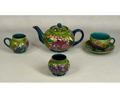 MOORCROFT FINCH & BERRIES TEA SET, on green ground, comprising circular squat teapot, milk jug, sugar basin, cup, and saucerP