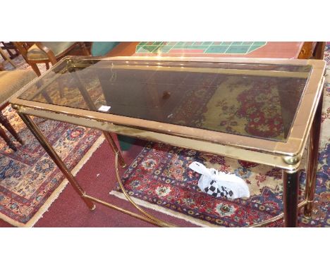 A 1970's Italian brass console table with smokey glass top, H:79cm W:110cm D:36cm