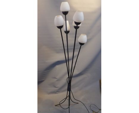A 1960's French six light standing lamp, having flower shaped frosted glass shades on cast metal stem supports, raised on tri