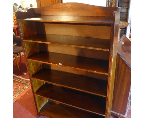 An early 20th Century oak open bookcase with form adjustable shelves raised on bracket base, H;140cm W:91cm D:25cm