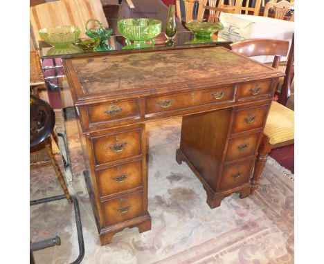 A 19th century mahogany pedestal desk having an arrangements of nine drawers raised on carved bracket feet, H:79cm W;91cm D:4