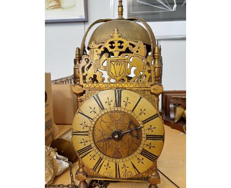 A Late 17th Century Style Brass Lantern Clock, four posted case with pierced top frets, 6.5 in roman numeral chattering beari
