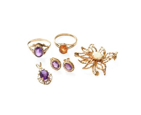 A 9 Carat Gold Opal Brooch, of textured floral spray design, measures 3.5cm by 3cm; A 9 Carat Gold Amethyst Ring, finger size