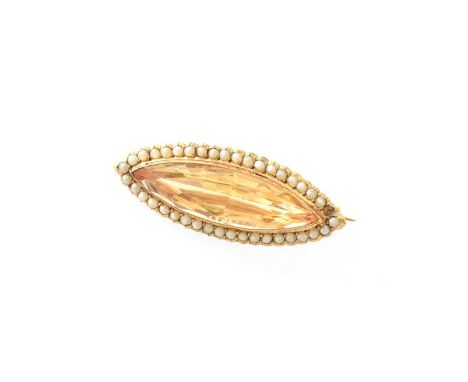 A Citrine and Split Pearl Brooch, the marquise cut citrine in a yellow rubbed over setting, within a border of split pearls, 