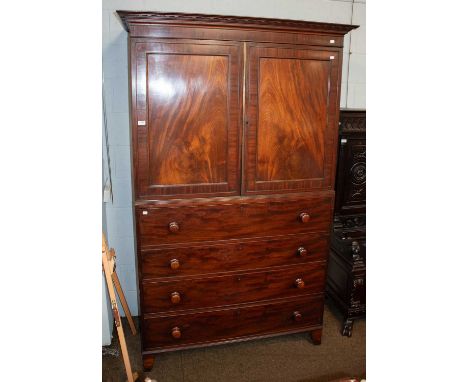 A George III Mahogany Secretaire Press, the upper section opening to reveal four slides, the fall-front secretaire section op