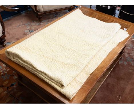 A Late 19th Century Durham Yellow Cotton Wholecloth Quilt, with matching yellow reverse, hand quiltedFading and wear, some br