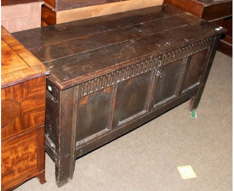 A 17th Century Panneled Coffer, with knulled carved frieze, 134cm by, 54cm by 68cm