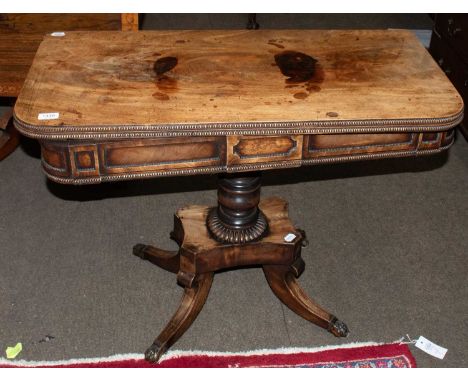 A Regency Mahogany Fold Over Card Table, with beaded frieze and platform base issuing four legs, 90cm by 44cm by 71cm