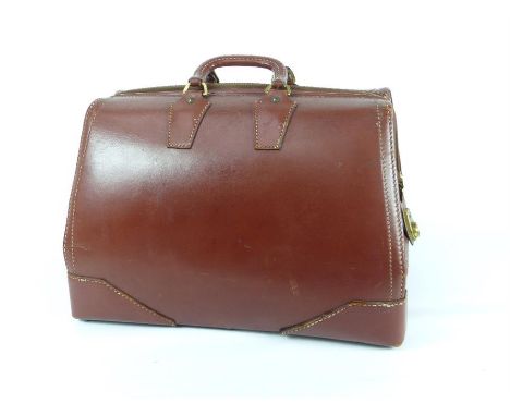 A large brown leather American Gladstone bag from the 1940's, made by Warren of Worcester, Massachusetts with two leather car