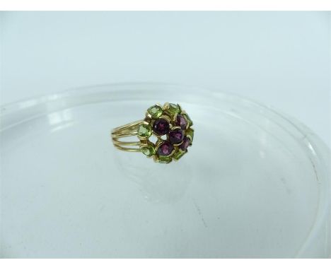 A 9 carat gold amethyst and peridot cluster cocktail ring; 5 g; size R 1/2