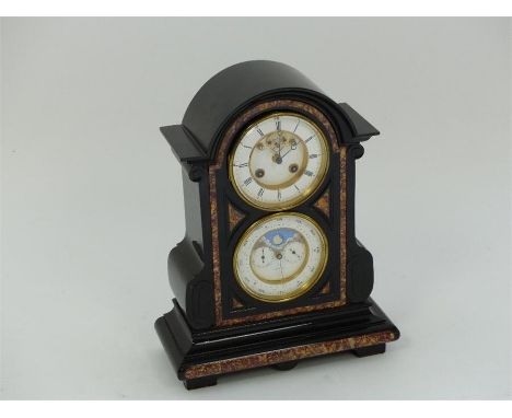 A late Victorian black slate and marble mantle clock, featuring two white enamel dials with the upper dial (with Roman numera