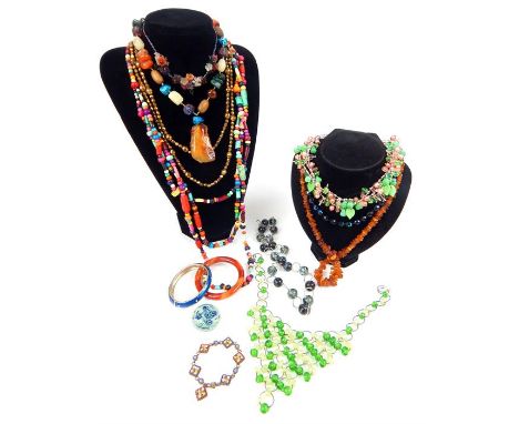 A large assortment of vintage jewellery including an agate bangle, a micro-mosaic bracelet, a string of natural amber beads a