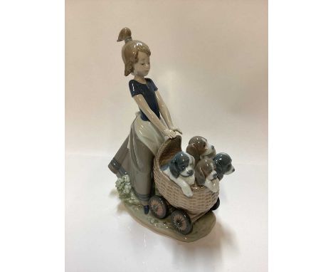 Three Lladro porcelain figure groups - girl with pram full of puppies 5364, girl with dog 5688 and girl on tricycle with kitt