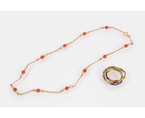 9ct gold chain interspaced with gold and coral beads, 38.5cm long and a yellow metal enamelled 'Russian' ring, size M½9ct gol