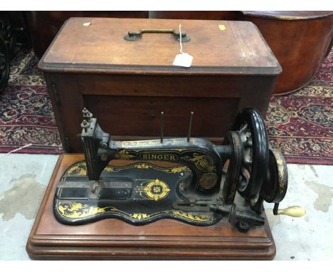 Vintage Singer sewing machine with cover