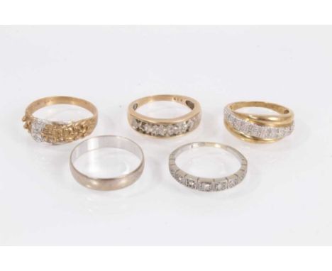 Five 9ct gold rings to include three diamond set half eternity style rings, diamond set buckle ring and a wedding band Total 