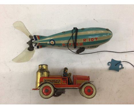 Box of children's toys including tin plate Marx airship, looping motor car, various building blocks and sets.