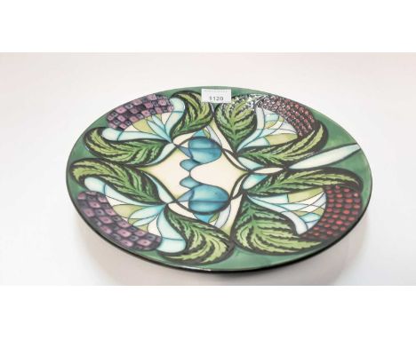 Moorcroft pottery circular charger decorated in the Blackwell by Nicola Slaney, dated 2008, 28cm diameterGood condition altho