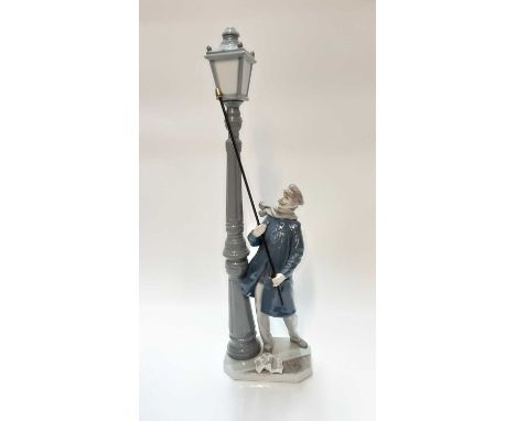 Lladro porcelain figure of a man lighting street lamp, 47.5cm high