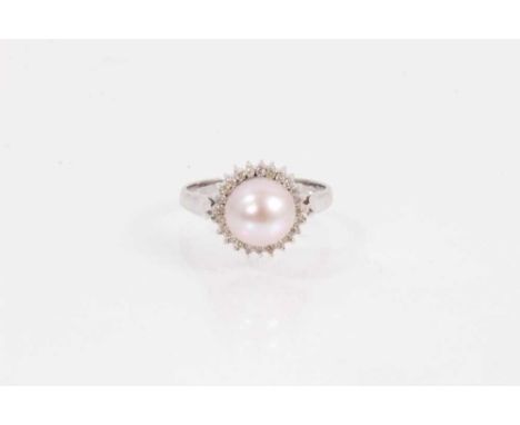 18ct white gold pearl and diamond ring with a cultured mabé pearl measuring approximatley 8.2mm diameter, surrounded by a bor