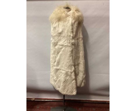 1930s white fur possibly ermine, evening cloak lined in cream silk and round fur-covered button fastening, lamb's fleece coll