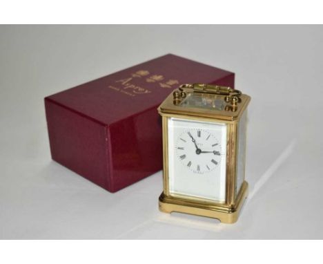 Brass-cased carriage clock by Asprey, in original box, 12cm high