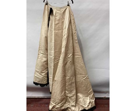 Victorian cream satin skirt with train and scalloped black velvet trim. Victorian black satin boned bodice, small button to f