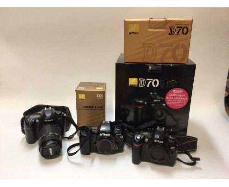 Group of Nikon DSLRs and accessories, including a D70 kit, F90X body, D100 and lens, flashes, etc, together with a camcorder,