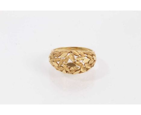 18ct gold ring with foliate decoration, size N½Shank stamped 750 and weighs 5.1 grams 