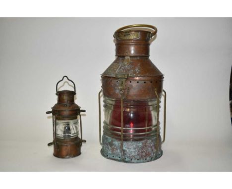 Large copper 'Seahorse' ship's lantern and another smaller, the larger measuring 50cm highThe larger lamp has two chips to th