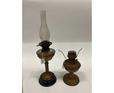 Early 20th century brass and ceramic oil lamp, together with another similar (2).