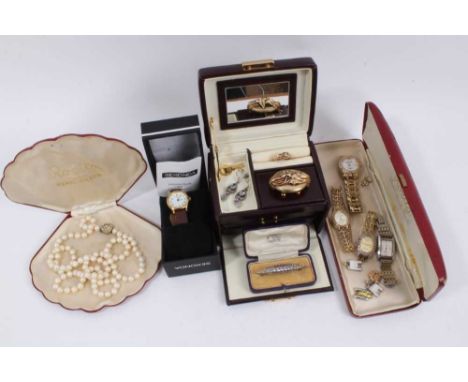 Late 19th century mourning brooch with leaf decoration and glazed locket compartment containing hair, yellow metal knot ring,