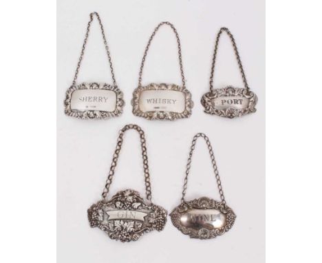 Five silver spirit labels to include Port (Birmingham 1965), Whisky (Birmingham 1968), Sherry (Sheffield 1976), Wine (Birming