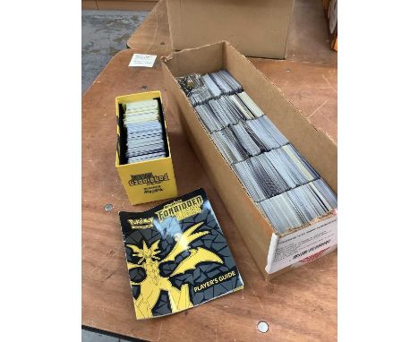 Box containing large quantity of Sun &amp; Moon Forbidden Light Pokemon Cards.