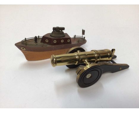 Novelty lighter in the form of a cannon and another in the form of a boat (2)