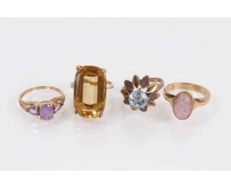 9ct gold large citrine cocktail ring, two other 9ct gold gem set dress rings and a yellow metal opalescent cabochon ring (4)T