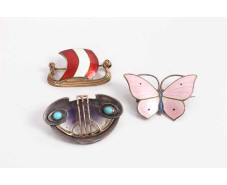 Norwegian silver and enamel Viking longship brooch, silver and enamel butterfly brooch and an Art Nouveau silver, shell and t
