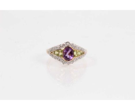 9ct gold amethyst, peridot and diamond ring with a central oval mixed cut amethyst flanked by graduating peridots and surroun