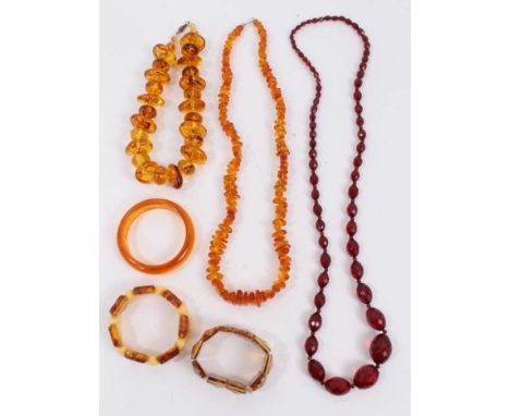 Amber bead necklace, one other necklace, vintage simulated cherry amber faceted bead necklace and three bracelets 