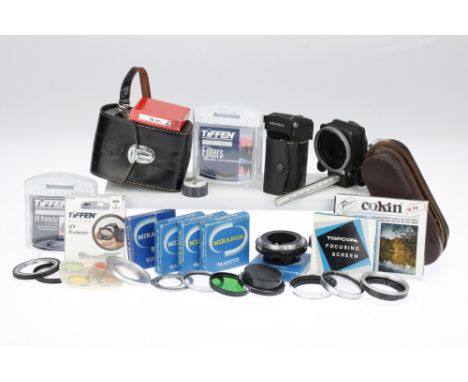 A Collection of Accessories and Filters including a Miranda 5x-15x finder magnifier, a Petri Macro Bellows, a small Asahi acc
