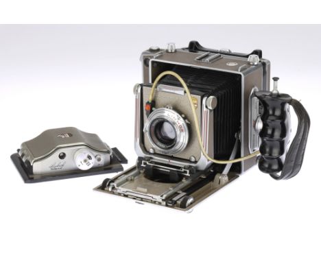 A Linhof Technika IV 4x5 Large Format Folding Rangefinder Camera, tan &amp; chrome, body G, bellows worn but appear to be lig