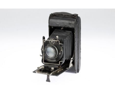 A Dallmeyer Folding Camera, black, body P-F, shutter working but sticks, optics P, some fungus &amp; haze present,