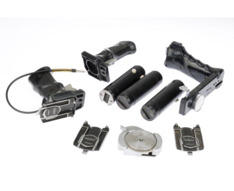 A Selection of Camera Accessories, to include a Rollei pistol grip, another grip missing parts, two tripod adapters, three fl
